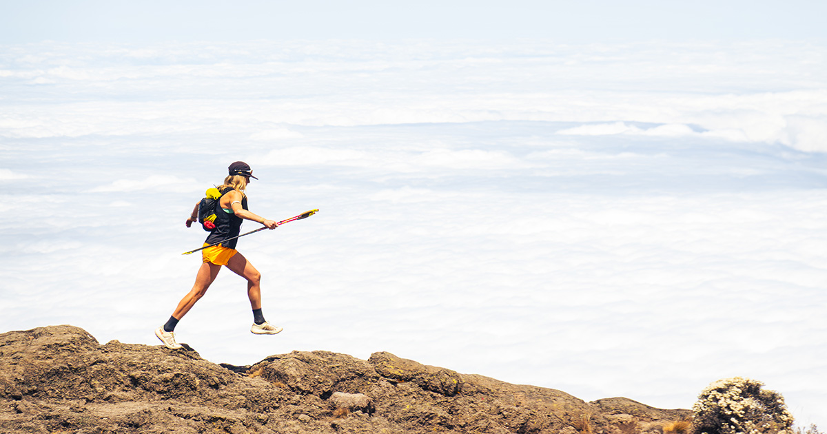 Erin Ton running above the clouds